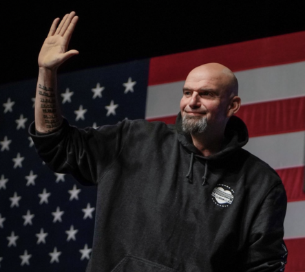 John Fetterman waves to a crowd of supporters on Election Night.